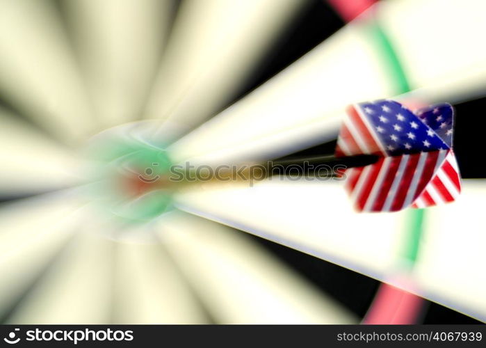 A stock photograph of a dart board with a dart hitting the bulls eye.