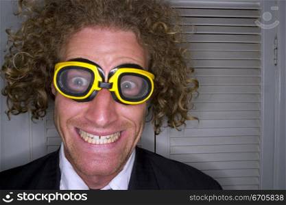 A stock photograph of a freaky man with goggles on.