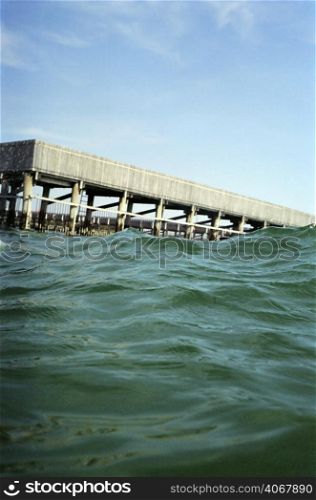 A stock photograph of a jetty viewed from the water.