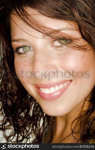 A stock photograph of a portrait of a beautiful young woman with perfect skin.