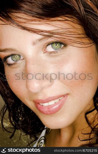 A stock photograph of a portrait of a beautiful young woman with perfect skin.