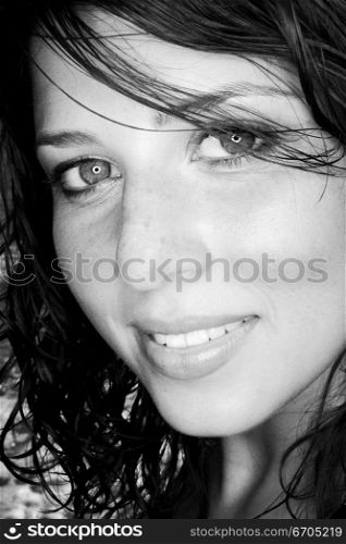 A stock photograph of a portrait of a beautiful young woman with perfect skin.