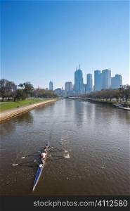 A stock photograph of a team of rowing training in Melbourne Australia