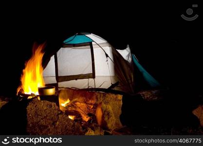 A stock photograph of a tent in a camping ground.
