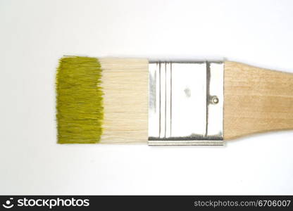 A stock photograph of an artists paint brush with fresh colorful paint on its bristles.