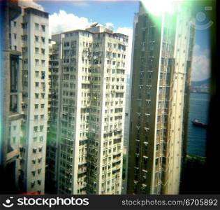 A stock photograph of high density living in Hong Kong, using a Holga camera which acheives an artistic and photographic effect.