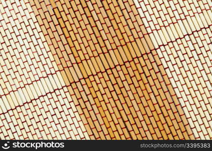 a straw mat (placemat, tablerunner), a closeup shot
