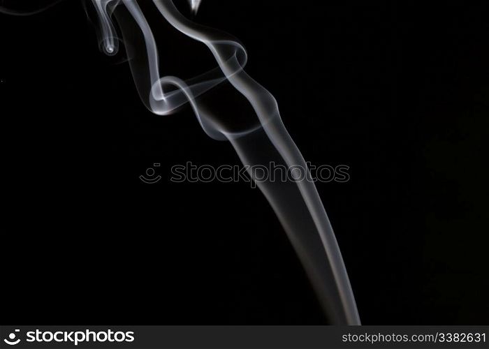 A stream of smoke on a black background