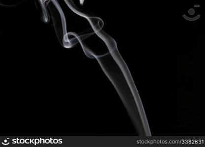A stream of smoke on a black background