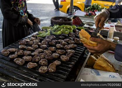 A street food, traditional barbecued meatballs.