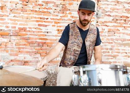 A street muscian playing drums. Feel the beat