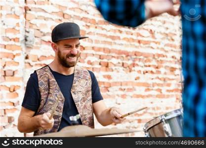 A street muscian playing drums. Feel the beat