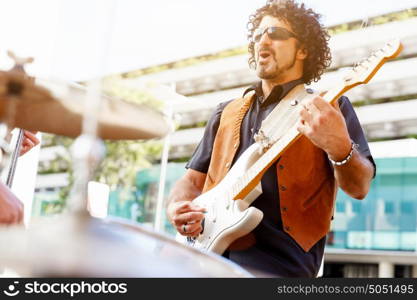 A street musician playing his guitar. Love my music