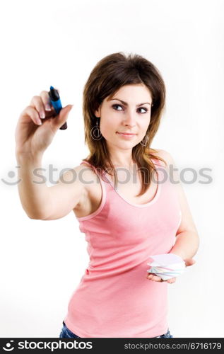 A student in t-shirt with blue pen