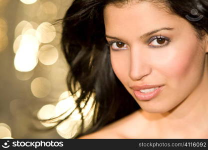 A stunningly beautiful young hispanic woman looking sultry