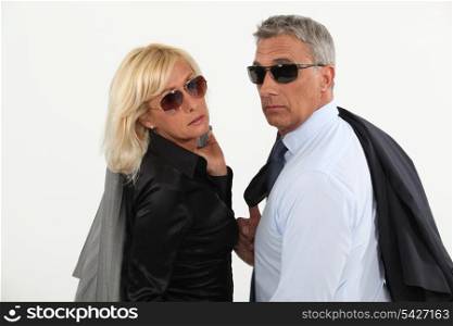 A stylish businesspeople couple.