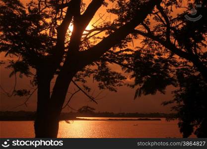 a sunset at the Mekong river in the town of Savannakhet in central Lao in the region of Khammuan in Lao in Souteastasia.. ASIA LAO KHAMMUAN REGION