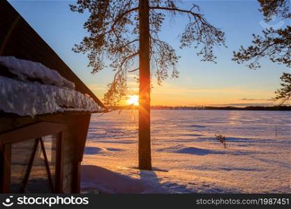 a sunset in the winter landscape of Sweden