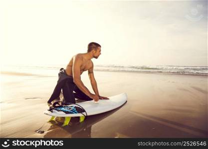 A surfer getting ready for the surf