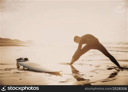 A surfer warming up before going surf
