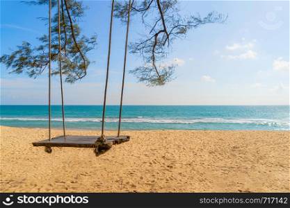 A swing near the beach for travel trip and holidays vacation outdoors background. Ocean or nature sea at noon, Phuket, Thailand