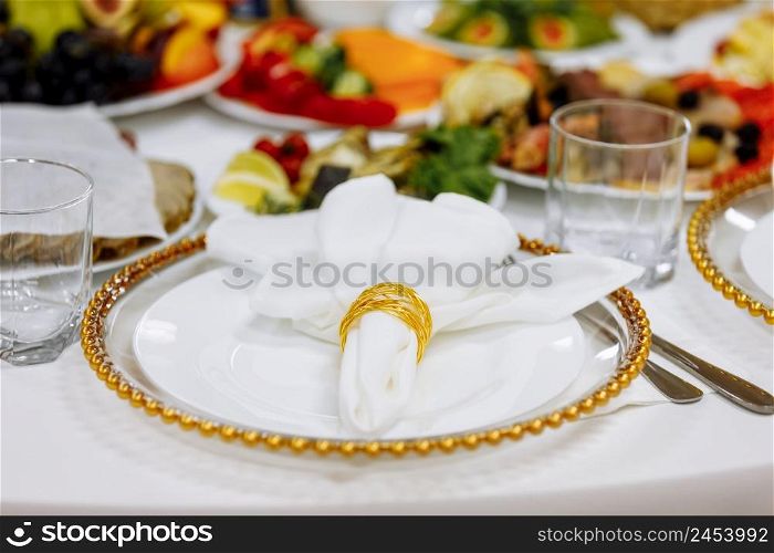 a table with a tablecloth, a beautiful serving of white dishes, a beautiful plate, dinner in a restaurant.. a table with a tablecloth, a beautiful serving of white dishes, a beautiful plate, dinner in a restaurant