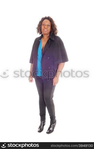 A tall African American woman in black tights and jacket standing isolated for white background, whit curly hair.