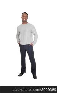 A tall good looking African American man standing in dress pants anda gray sweater from the front, isolated for white background