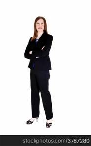 A tall slim young business woman standing in a black suit from the front,with her arms crossed, isolated for white background.