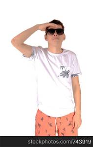A tall young teenager boy in a white shirt and Bermuda shorts wearingsunglasses looking fare away, isolated for white background
