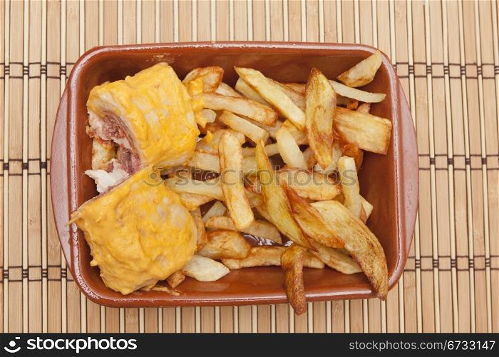 a tapa of meat filled with ham and cheese
