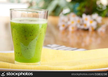 A tasty kiwi smoothie in a natural setting