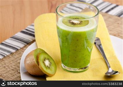 A tasty kiwi smoothie in a natural setting