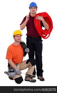 A team of construction workers with their tools and building materials