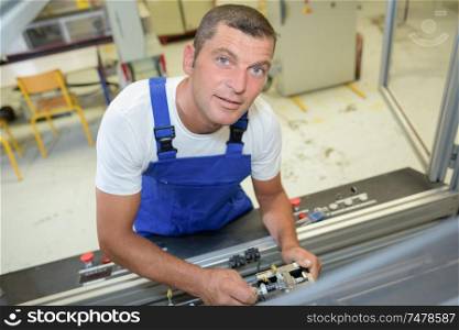 a technician at work posing
