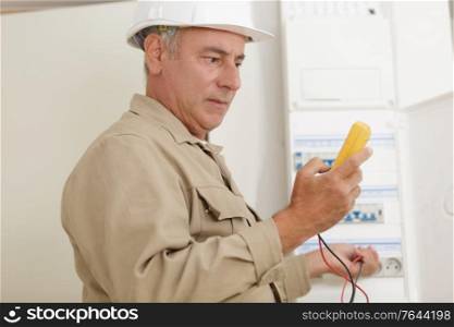 a technician with electricity measurer