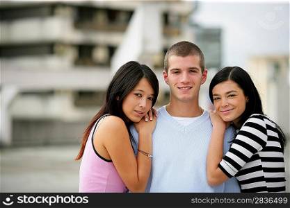 A teenage boy surrounded by girls
