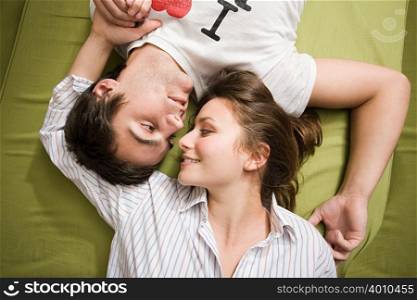 A teenage couple lying down