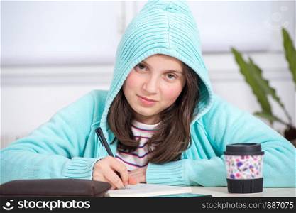 a teenage girl doing her homework