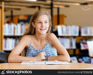 A teenage girl with a book in library. I love reading