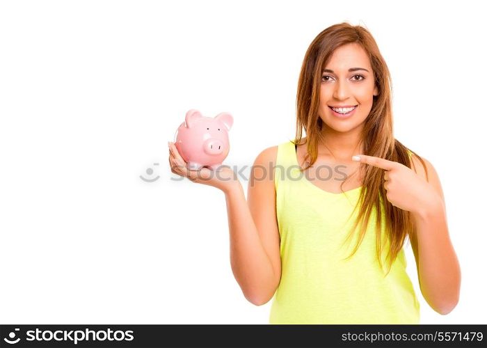 A teenager holding a piggy bank (money box) - savings concept