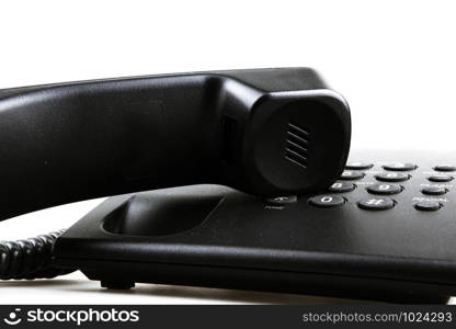 A telephone or phone, is a telecommunications device that permits two or more users to conduct a conversation when they are too far apart to be heard directly.