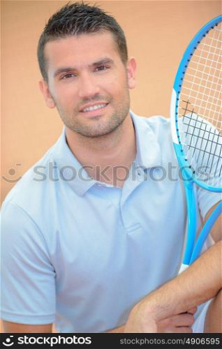 a tennis player is posing