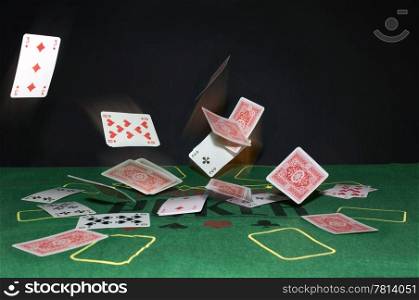 A Texas Hold &rsquo;m Poker theme with playing cards bouncing off the table in all directions.