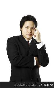A thinking businessman in black suit (isolated white)