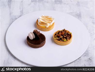 A three pieces of cakes isolated on a white background. Three pieces of cakes isolated on a white background