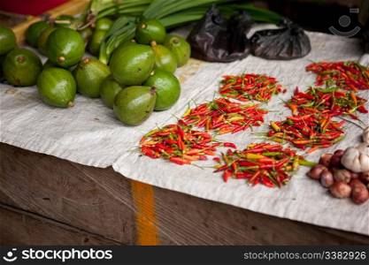 A thrid world food market with chilli and fruit