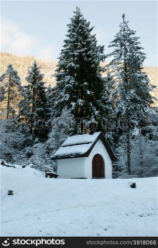 A tiny church beside a mountain road in Austria