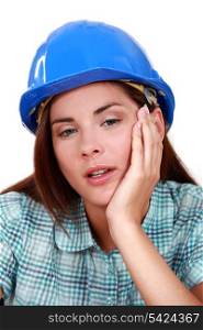 A tired-looking tradeswoman