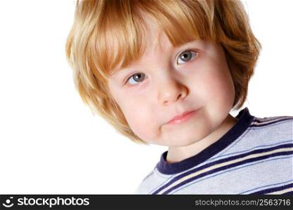 A toddler boy with a serious expression
